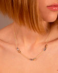 Rolo Chain Necklace with Intertwined Two-Tone Oval Elements in 375 Gold