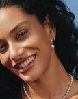 GOLD SHELL PEARL DANGLING TWISTED HUGGIE HOOP EARRINGS